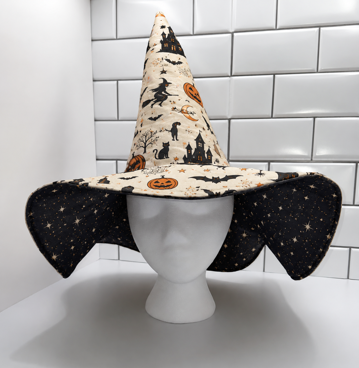 Halloween Quilted Witch Hat for Women – Soft Padded Witch Costume Hat with Pumpkin, Bat & Haunted House Print. QWHPETAL1