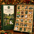 May include: A 24-day countdown advent calendar titled The Golfer's Club, featuring a green box with a golf course illustration and a matching open display case containing 24 individual acrylic golf-themed ornaments, including trophies, clubs, and carts.