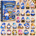 May include: A Hanukkah Gnome Celebration advent calendar box featuring 24 acrylic ornaments. The box displays a gnome holding a menorah and dreidel. The 24 individual ornaments depict various gnomes with Hanukkah symbols like menorahs, dreidels, stars of David, gifts, and food items, all rendered in blue, gold, and white color schemes.