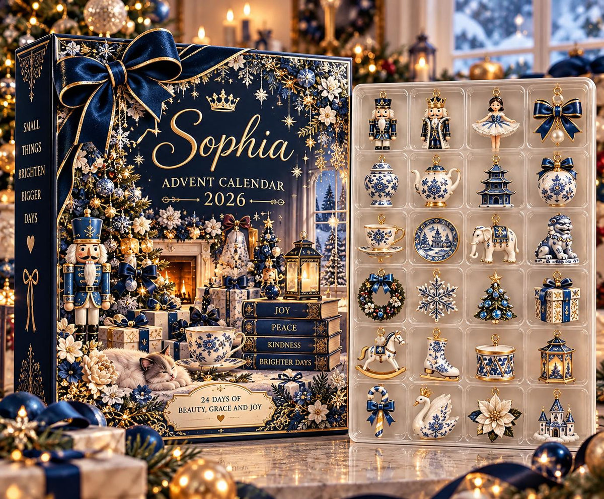 May include: A navy blue Sophia Advent Calendar 2026 box featuring a large bow, a nutcracker, and a cat, with text reading Small Things Brighten Bigger Days, Joy, Peace, Kindness, Brighter Days, and 24 Days of Beauty, Grace and Joy.